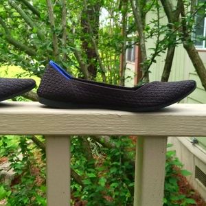 Rothy's pointed toe flat, black, signature blue halo